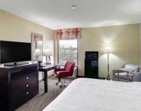 Spacious king size bed with workspace at Hampton Inn Hickory.