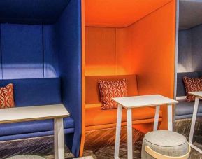 Comfortable and colorful work space cubicles at Tru by Hilton Bowling Green.