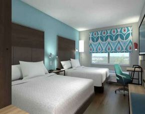 Double king beds with work desk area at Tru by Hilton Edinburg.