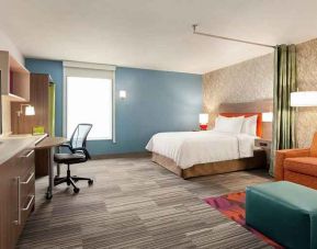 Spacious king bedroom with work space at Home2 Suites by Hilton Silver Spring.