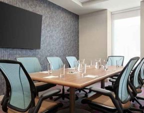 Small, professional meeting room at Home2 Suites by Hilton Silver Spring.