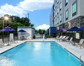 Relaxing outdoor pool area at the Hampton Inn & Suites Houston East Beltway 8.