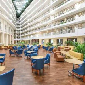 Beautiful and bright outdoor workspace with sofas and chairs at the Embassy Suites by Hilton Alexandria-Old Town.