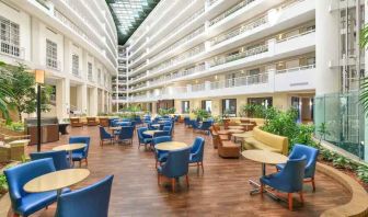 Beautiful and bright outdoor workspace with sofas and chairs at the Embassy Suites by Hilton Alexandria-Old Town.