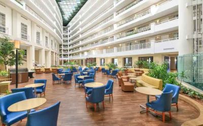 Beautiful and bright outdoor workspace with sofas and chairs at the Embassy Suites by Hilton Alexandria-Old Town.