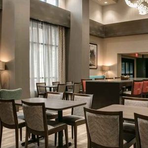 Well-lit, spacious lounge and work area for coworking at Hampton Inn Wichita Northwest.