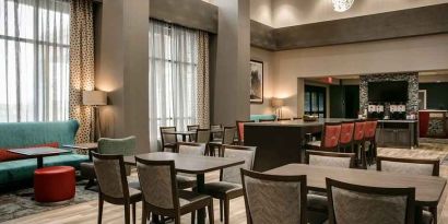Well-lit, spacious lounge and work area for coworking at Hampton Inn Wichita Northwest.
