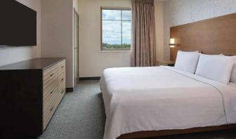 comfortable king bed at Embassy Suites by Hilton Oahu Kapolei.