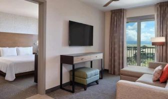 luxurious king bed at Embassy Suites by Hilton Oahu Kapolei.