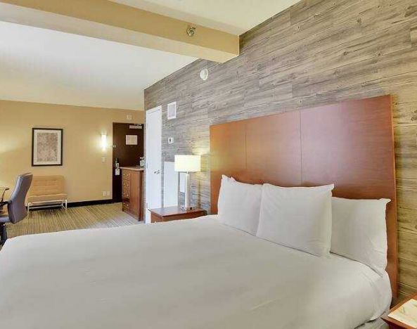 Stylish bedroom with king bed and working station at the DoubleTree Suites by Hilton Houston by the Galleria.