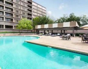 Relaxing outdoor pool area at the DoubleTree Suites by Hilton Houston by the Galleria.