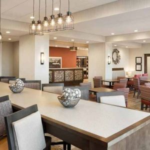 Bright-lit lobby and coworking space at Hampton Inn By Hilton, Salt Lake City Cottonwood.