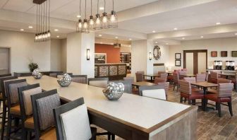 Bright-lit lobby and coworking space at Hampton Inn By Hilton, Salt Lake City Cottonwood.