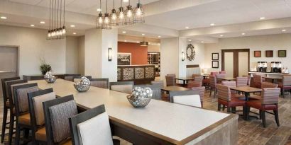 Bright-lit lobby and coworking space at Hampton Inn By Hilton, Salt Lake City Cottonwood.
