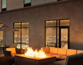 beautiful outdoor patio with comfortable seating and coworking space at Hampton Inn Salt Lake City Cottonwood.
