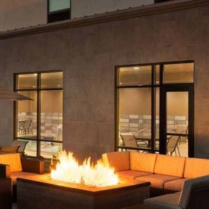 Beautiful outdoor patio with comfortable seating and coworking space at Hampton Inn By Hilton, Salt Lake City Cottonwood.