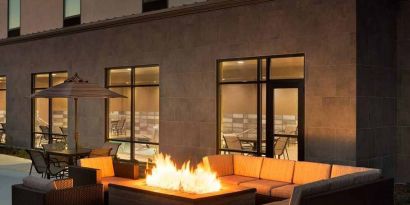 Beautiful outdoor patio with comfortable seating and coworking space at Hampton Inn By Hilton, Salt Lake City Cottonwood.