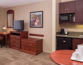 Comfortable and spacious living room with table and kitchenette at the Hampton Inn Columbia Northeast-Fort Jackson Area, SC.