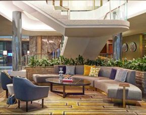Elegant courtyard lobby perfect as workspace at the Statler Dallas, Curio Collection by Hilton.