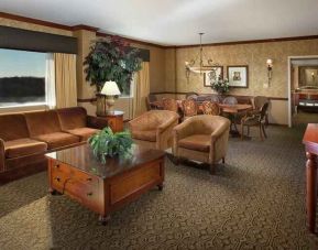 Spacious living room in a hotel suite at the DoubleTree by Hilton Lisle-Naperville.