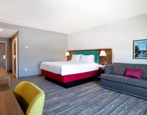 Spacious king suite with 1 king bed, sofabed and desk at the Hampton Inn & Suites Outtawa West