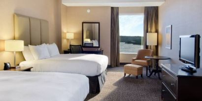 Spacious room with 2 queen beds, work desk and view of the harbour at the Hilton Saint John.