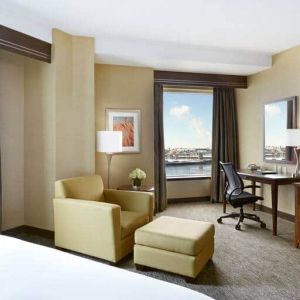 Day use room with work desk and lounge area at the Hilton Saint John.