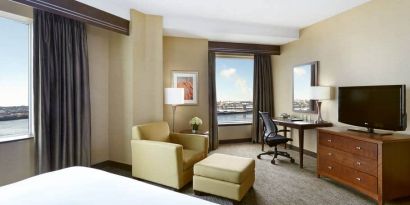 Day use room with work desk and lounge area at the Hilton Saint John.