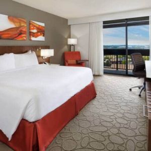 Bright and spacious day use room with view, work desk, sofa and private bathroom at Hilton Mississauga Meadowvale.