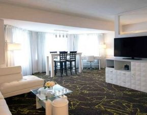 Spacious and comfortable living room in a king suite at the The Roslyn, Tapestry Collection by Hilton.