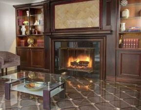 Beautiful library area with fireplace perfect as workspace at the The Roslyn, Tapestry Collection by Hilton.