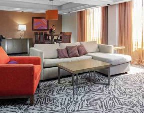 Spacious presidential suite with sofa and lunges at the DoubleTree by Hilton Omaha-Downtown.