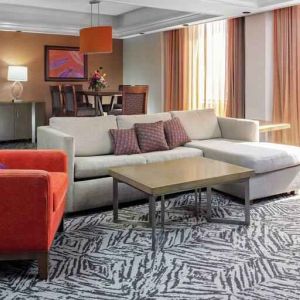Spacious presidential suite with sofa and lounges at the DoubleTree by Hilton Omaha-Downtown.