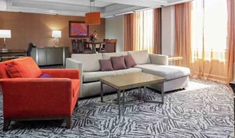 Spacious presidential suite with sofa and lounges at the DoubleTree by Hilton Omaha-Downtown.