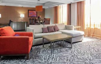 Spacious presidential suite with sofa and lounges at the DoubleTree by Hilton Omaha-Downtown.