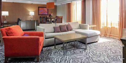 Spacious presidential suite with sofa and lounges at the DoubleTree by Hilton Omaha-Downtown.