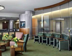 Beautiful lobby area with lounges and chairs perfect as workspace at the DoubleTree by Hilton Omaha-Downtown.