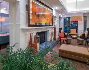 Elegant lobby area with fireplace perfect as workspace at the Hilton Garden Inn Tallahassee Central.