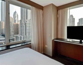 King guestroom with city view at the Embassy Suites by Hilton Chicago Magnificent Mile.