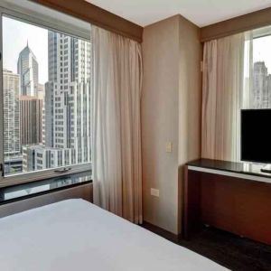 King guestroom with city view at the Embassy Suites by Hilton Chicago Magnificent Mile.