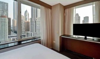 King guestroom with city view at the Embassy Suites by Hilton Chicago Magnificent Mile.