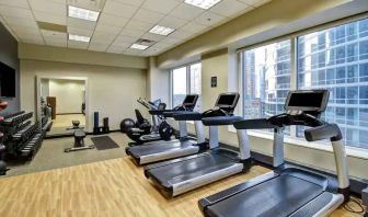 Fitness center with treadmills at the Embassy Suites by Hilton Chicago Magnificent Mile.