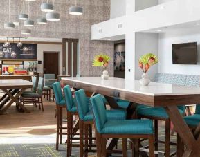 bright-lit, comfortable lobby-lounge and coworking space at Hampton Inn & Suites Sunnyvale Silicon Valley.