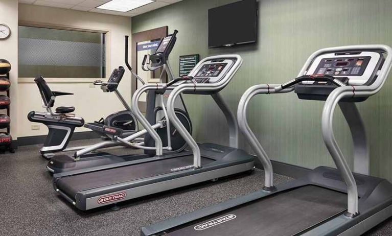 Well-equipped fitness center at Hampton Inn Chicago-Midway Airport.