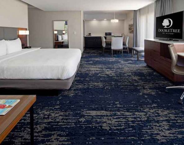 spacious king suite with work desk and lounge area at DoubleTree by Hilton Hotel Bakersfield.