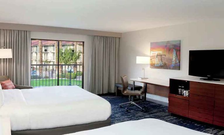 Gorgeous queen room with natural light, TV, and work area at DoubleTree by Hilton Hotel Bakersfield.