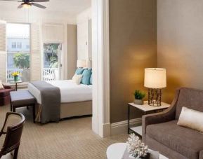 Spacious living room with working station in a king suite at the Hotel del Coronado, Curio Collection by Hilton.