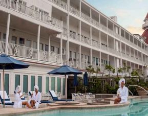 Relaxing area with pool and lounges at the Hotel del Coronado, Curio Collection by Hilton.