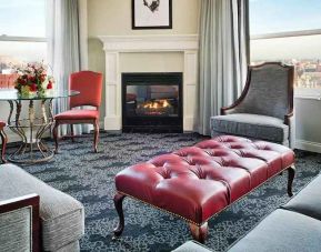 Bright and comfortable presidential suite with sofas and fireplace at the Embassy Suites by Hilton Portland-Downtown.