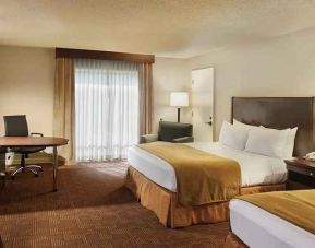 beautiful queen bedroom work desk and TV at DoubleTree by Hilton Hotel Sacramento.
